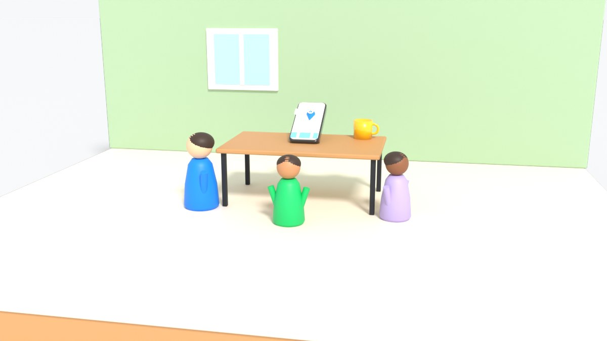 A parent and two teenagers look at a phone with a map at a kitchen table