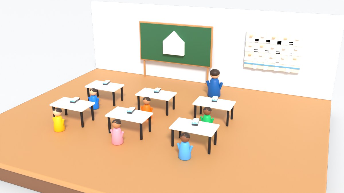 Pupils at desks face a teacher, a chalkboard with a house and a map on the wall
