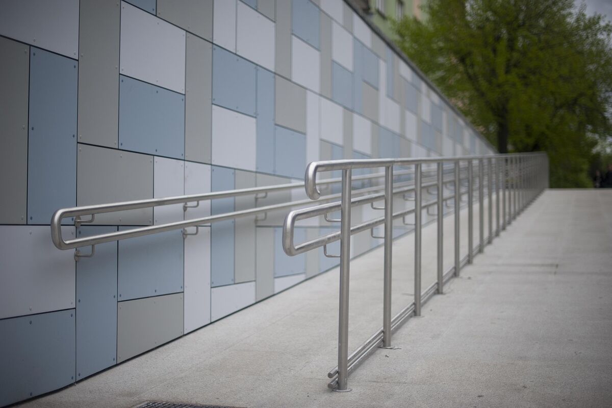 A smooth accessible ramp beside steps