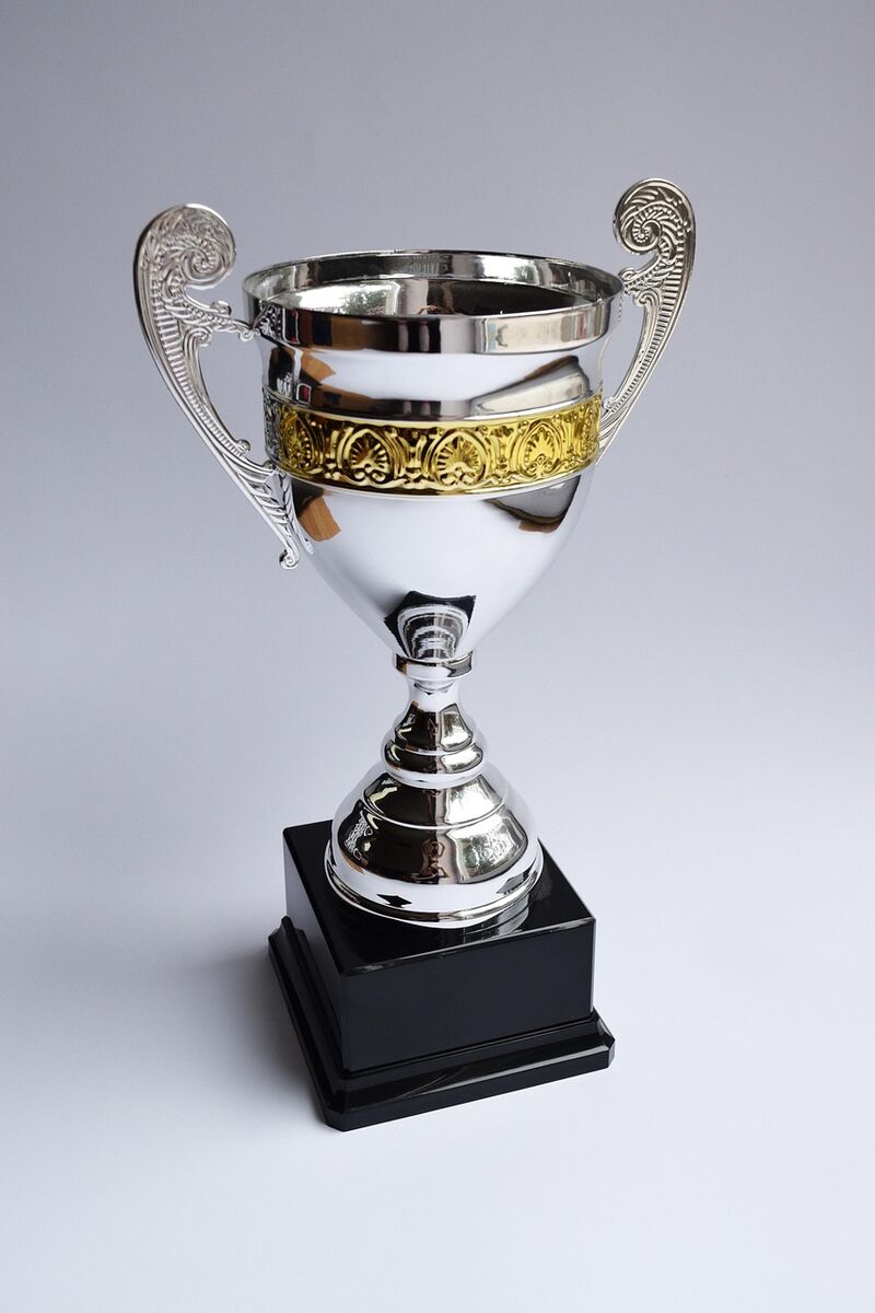 A golden trophy in dramatic light