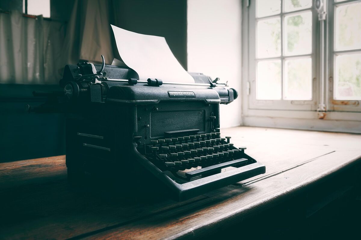 A vintage typewriter with paper loaded