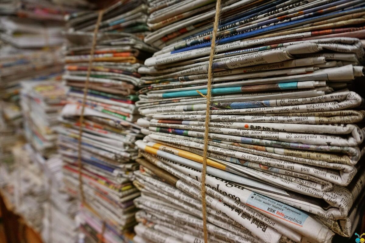 A stack of folded newspapers