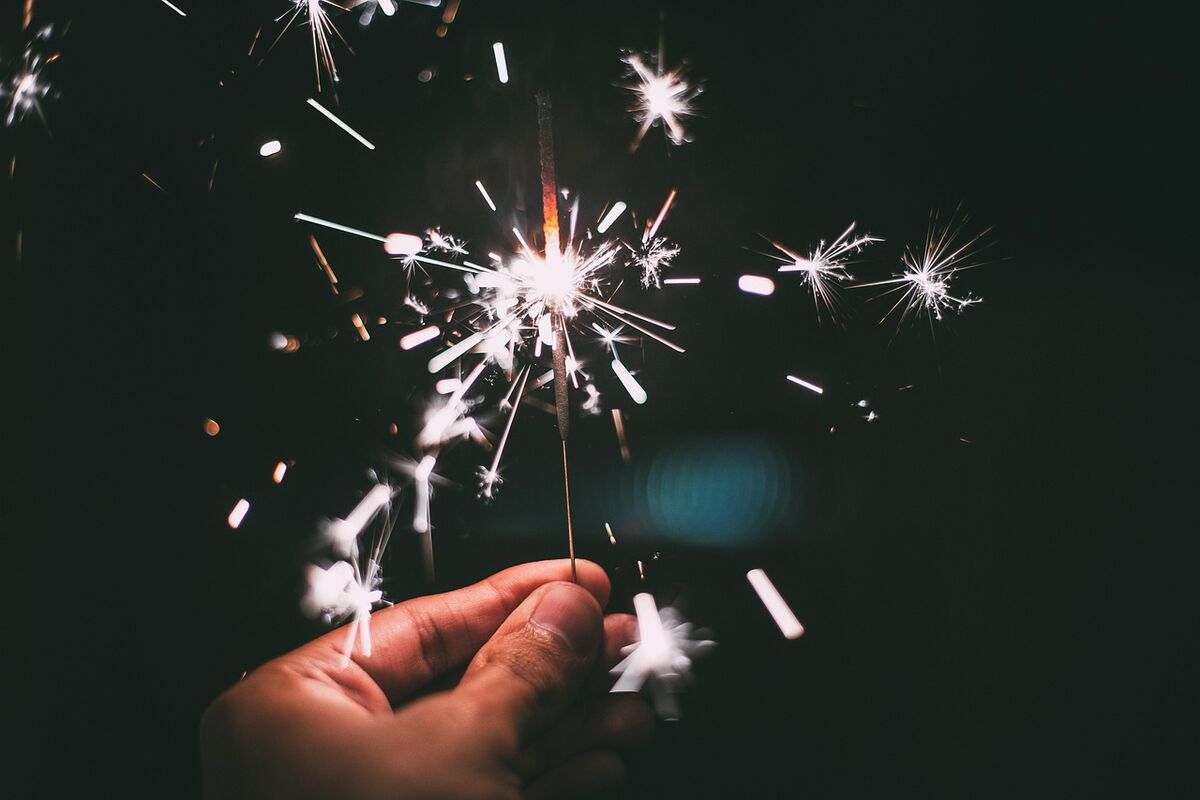 A sparkler burning bright against the dark